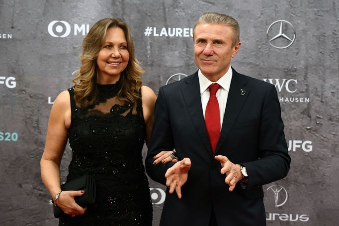 Former Ukranian pole vaulter Sergey Bubka, accompanied by his wife Lilia Tutunik, poses as he arrives to the ceremony of the Laureus World Sports Awards 2020 in Berlin, G