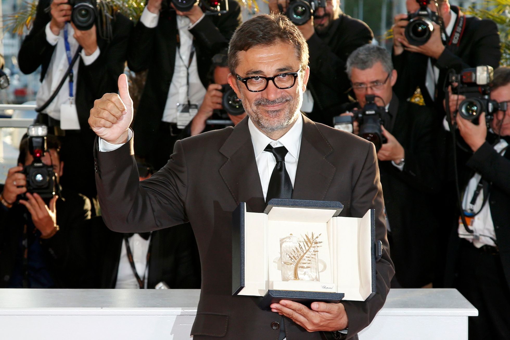 Director Nuri Bilge Ceylan, Palme d'Or award winner for his film &quot;Winter Sleep&quot;, poses during a photocall at the closing ceremony of the 67th Cannes Film Festival in Cannes