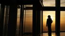 ATTENTION EDITORS - EMBARGOED FOR PUBLICATION TO 00:01 GMT JANUARY 11, 2013 An employee poses during sunrise as she looks out the window from The View gallery at the Shard, western Europe's tallest building, in London January 8, 2013. The View, the public viewing deck accessible by high speed elevators on the 309 metre (1013 feet) Shard building, opens on February 1. Picture taken January 8, 2013. REUTERS/Stefan Wermuth (BRITAIN - Tags: TRAVEL CITYSCAPE) TEMPLATE OUT Published: Led. 10, 2013, 12:06 odp.