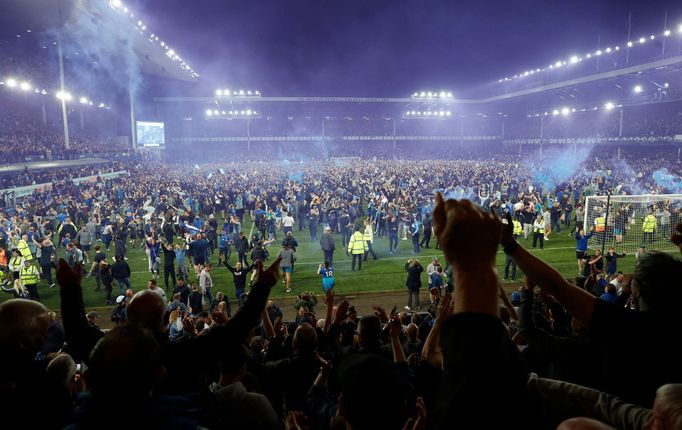 Soccer Football - Premier League - Everton v Crystal Palace - Goodison Park, Liverpool, Britain - May 19, 2022 Everton fans invade the pitch after the match as they celeb