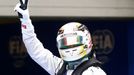 Mercedes Formula One driver Lewis Hamilton of Britain gestures as he celebrates taking pole position after the qualifying session for the Chinese F1 Grand Prix at the Sha