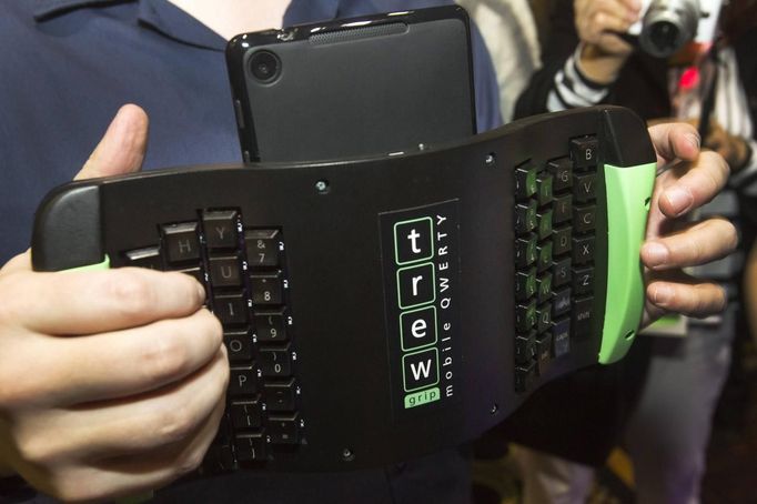 A TREWGrip keyboard is shown during "CES Unveiled," a media preview event to the annual Consumer Electronics Show (CES), in Las Vegas, Nevada, January 5, 2014. The keyboard keys face away from the user but allows people to type and enter data into a tablet while standing up.