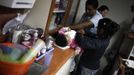 Nurses help a child in the San Jose Hospice, in Sacatepequez, 45 km (28 miles) of Guatemala City, November 30, 2012. About 68 HIV-infected children receive free medical care at the hospice, many of them were found abandoned in markets, churches, fire stations, left neglected in hospitals or in some instances, brought in by their families who cannot afford to pay for their medical treatment. World AIDS Day which falls on December 1 is commemorated across the world to raise awareness of the pandemic. REUTERS/Jorge Dan Lopez (GUATEMALA - Tags: ANNIVERSARY HEALTH) Published: Pro. 1, 2012, 1:51 dop.