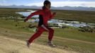 Marathon runner Gladys Tejeda, the first Peruvian athlete who qualified for the 2012 London Olympic Games, runs during her training in the Andean province of Junin May 14, 2012. A private company will take Gladys' mother Marcelina Pucuhuaranga, 69, to London as part of the "Thank you Mom" program. For Pucuhuaranga, who received her first passport, it will be the first time travelling out of Peru. The program will take about 120 mothers of different athletes around the world to attend the games. Tejeda, the youngest of nine children, returned to her hometown to visit her mother and to focus on training where she will run more than 20 km every day in the highlands (over 4,105 meters above sea level). Picture taken May 14, 2012. REUTERS/Pilar Olivares (PERU - Tags: SPORT ATHLETICS OLYMPICS) Published: Kvě. 17, 2012, 7:01 odp.