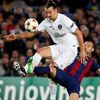Paris St Germain's Zlatan Ibrahimovic is challenged by Barcelona's Javier Mascherano during their Champions League Group F soccer match at the Nou Camp stadium in Barcelona