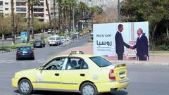 Billboard s prezidenty Sýrie a Ruska Bašárem Asadem a Vladimirem Putinem v centru Damašku.