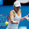 Sabine Lisicki of Germany hits a return to Monica Niculescu of Romania during their women's singles match at the Australian Open 2014 tennis tournament in Melbourne