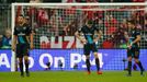 Arsenal's Francis Coquelin, Gabriel Paulista and Alexis Sanchez look dejected after David Alaba scored the third goal for Bayern Munich