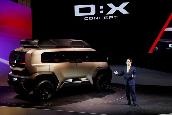 President and CEO of Mitsubishi Motors, Takao Kato unveils the Mitsubishi D:X Concept during a press day of the Japan Mobility Show 2023 at Tokyo Big Sight in Tokyo, Japa