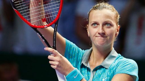 Petra Kvitova of the Czech Republic acknowledges the audience after defeating Maria Sharapova of Russia during their WTA Finals tennis match at the Singapore Indoor Stadi