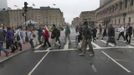 Residents, employees and business owners are escorted across Darmouth Street as they return to Boylston Street ahead of the city re-opening the area to the general public in Boston, Massachusetts April 23, 2013. The street has been closed since last week's bombings at the Boston Marathon finish line. REUTERS/Pat Greenhouse/Boston Globe/Handout (UNITED STATES) Published: Dub. 23, 2013, 8:30 odp.