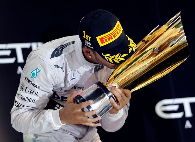 Mercedes Formula One driver Lewis Hamilton of Britain celebrates on the podium after winning the Abu Dhabi F1 Grand Prix at the Yas Marina circuit in Abu Dhabi November 2