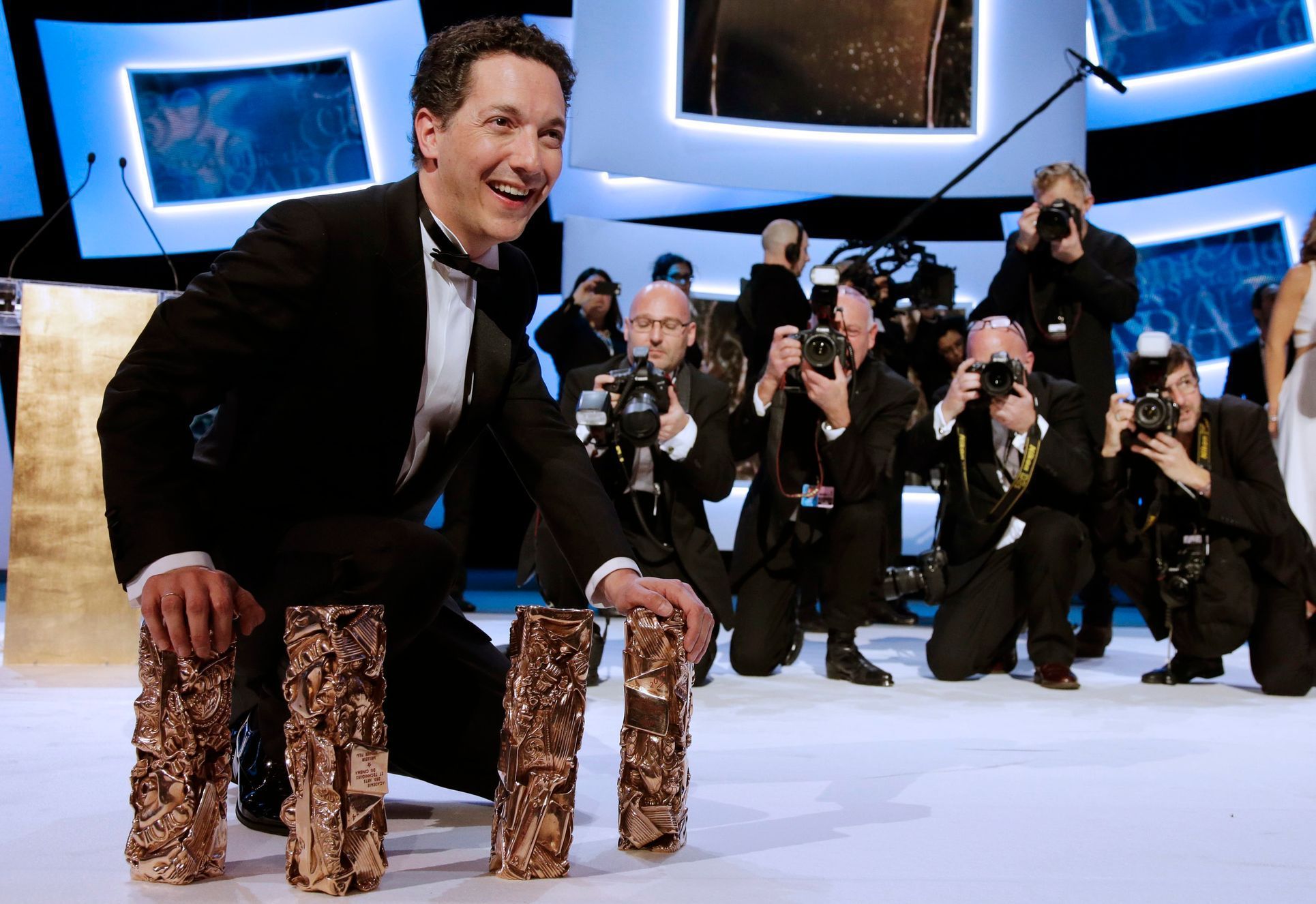 French actor and director Guillaume Gallienne poses with his trophies during the 39th Cesar Awards ceremony in Paris
