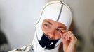 Mercedes Formula One driver Nico Rosberg of Germany wipes his eye during the first practice session of the German F1 Grand Prix at the Nuerburgring racing circuit, July 5