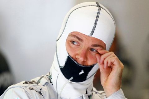 Mercedes Formula One driver Nico Rosberg wipes his eye durin