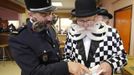 Participants read documents as they take part in the 2012 European Beard and Moustache Championships in Wittersdorf near Mulhouse, Eastern France, September 22, 2012. More than a hundred participants competed in the first European Beard and Moustache Championships organized in France. REUTERS/Vincent Kessler (FRANCE - Tags: SOCIETY) Published: Zář. 22, 2012, 7:33 odp.