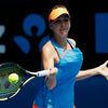 Belinda Bencic of Switzerland hits a return to  Li Na of China during their women's singles match at the Australian Open 2014 tennis tournament in Melbourne