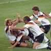 FILE PHOTO: West Germany's Brehme is mobbed by teammates after he scored the only goal of the World Cup final against Argentina on a penalty kick