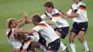 FILE PHOTO: West Germany's Brehme (L) is mobbed by teammates after he scored the only goal of the World Cup final against Argentina on a penalty kick July 8, 1990 in Rome