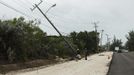 Workers repair a utility pole damaged by Hurricane Sandy in Kingston, October 25, 2012. Strengthening rapidly after tearing into Jamaica and crossing the warm Caribbean Sea, Sandy hit southeastern Cuba early on Thursday with 105-mph winds that cut power and blew over trees, with at least three fatalities in Jamaica and Haiti. REUTERS/Gilbert Bellamy (JAMAICA - Tags: ENVIRONMENT DISASTER) Published: Říj. 25, 2012, 5:58 odp.