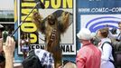 A man dressed as Chewbacca from Star Wars poses with fans outside of the 2015 Comic-Con International in San Diego