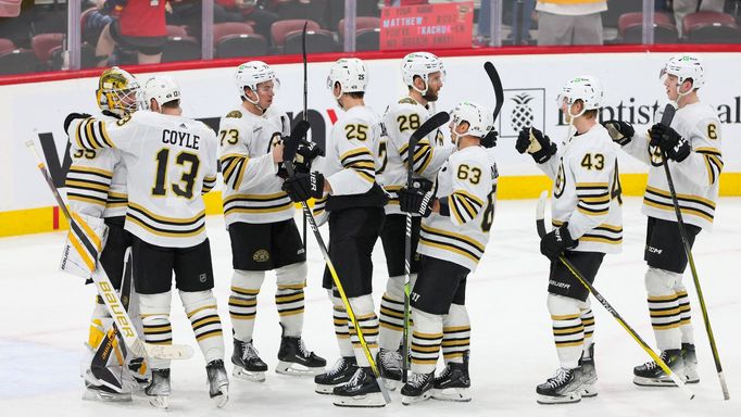 Nov 22, 2023; Sunrise, Florida, USA; The Boston Bruins celebrate after winning the game against the Florida Panthers at Amerant Bank Arena. Mandatory Credit: Sam Navarro-