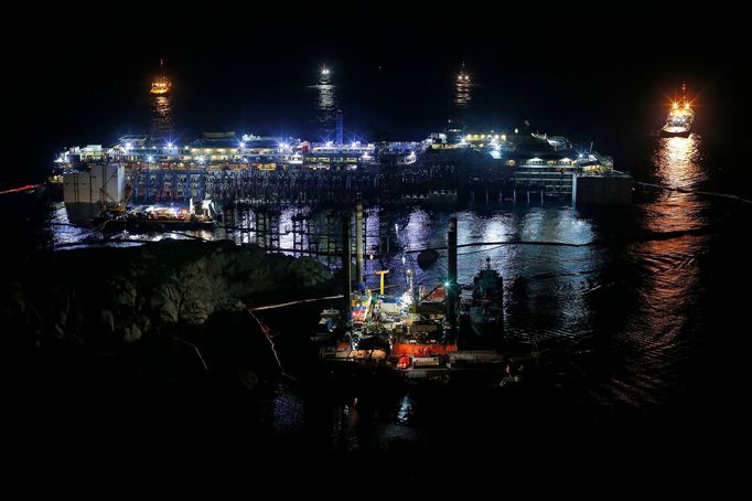 The Costa Concordia cruise liner is seen at Giglio harbour at Giglio Island, early July 18, 2014.