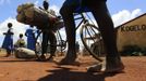 A student from Barack Obama Primary School walks from school in Kogelo village, the ancestral home of U.S. President Barack Obama, at Nyangoma Kogelo shopping centre, 430 km (367 miles) west of Kenya's capital Nairobi, November 5, 2012. Four years ago, Kogelo, and Africa in general, celebrated with noisy gusto when Obama, whose father came from the scattered hamlet of tin-roofed homes, became the first African-American to be elected president of the United States. Looking across the Atlantic to the Nov. 6 presidential election, the continent is cooler now towards the "son of Africa" who is seeking a second term. There are questions too whether his Republican rival, Mitt Romney, will have more to offer to sub-Saharan Africa if he wins the White House. To match Analysis AFRICA-USA/ELECTION REUTERS/Thomas Mukoya (KENYA - Tags: SOCIETY ELECTIONS POLITICS USA PRESIDENTIAL ELECTION) Published: Lis. 5, 2012, 11:21 dop.