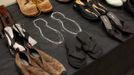 An outline of a pair of shoes representing a body that has not been found is shown among more than 1,000 pairs of shoes belonging to people who have jumped to their death from the Golden Gate Bridge in San Francisco, California May 27, 2012. The iconic bridge is celebrating its 75th anniversary with a series of events. REUTERS/Robert Galbraith (UNITED STATES - Tags: SOCIETY ANNIVERSARY) Published: Kvě. 27, 2012, 8:16 odp.