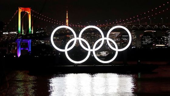 The giant Olympic rings are illuminated after being reinstalled at Odaiba Marine Park, amid the coronavirus disease (COVID 19) outbreak, in Tokyo