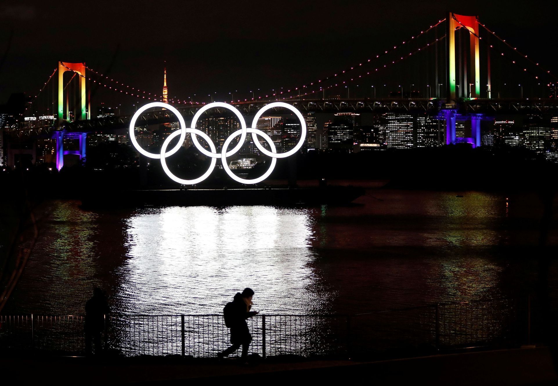 The giant Olympic rings are illuminated after being reinstalled at Odaiba Marine Park, amid the coronavirus disease (COVID 19) outbreak, in Tokyo