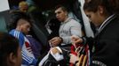 Members of the Gabarri-Valdes family distribute their belongings to different cars after a bulldozer demolished their home at the Spanish gypsy settlement of Puerta de Hierro, in the outskirts of Madrid November 20, 2012. Fifty-four families have been living in Puerta de Hierro, on the banks of the Manzanares river for over 50 years. Since the summer of 2010, the community has been subject to evictions on the grounds that the dwellings are illegal. Families, whose homes have been demolished, move in with relatives whose houses still remain while the debris keeps piling up around them as more demolitions take place. REUTERS/Susana Vera (SPAIN - Tags: CIVIL UNREST BUSINESS CONSTRUCTION) Published: Lis. 20, 2012, 4:56 odp.