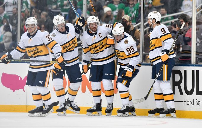 Jan 1, 2020; Dallas, TX, USA; Nashville Predators center Matt Duchene (95) celebrates with teammates after scoring a goal against the Dallas Stars during the first period