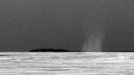 This is the first dust devil that NASA's Mars Exploration Rover Opportunity has observed in the rover's six-and-a-half years on Mars. The whirlwind appeared in a routine drive-direction image taken by Opportunity's panoramic camera right after a drive during the 2,301st Martian day, or sol, of the rover's mission on Mars (July 15, 2010). Contrast has been stretched, and the image has been carefully calibrated to make the dust devil easier to see against the Martian sky. Opportunity's twin, Spirit, has observed dozens of dust devils at its location in Gusev Crater halfway around Mars from Opportunity's location in the Meridian Planum region. Opportunity conducted systematic searches for dust devils in past years without seeing any. A rougher and dustier surface at Gusev makes dust devils form more readily there than at Meridiani. Image Credit: NASA/JPL-Caltech/Cornell University/Texas A