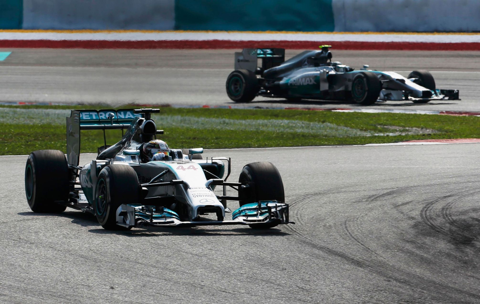 Mercedes Formula One driver Hamilton drives ahead of team mate Rosberg during the Malaysian F1 Grand Prix at Sepang International Circuit outside Kuala Lumpur