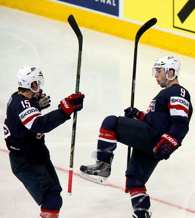 Tyler Johnson of the U.S. celebrates his goal against Finland with team mate Craig Smith (L) during the third period of their men's ice hockey World Championship Group B