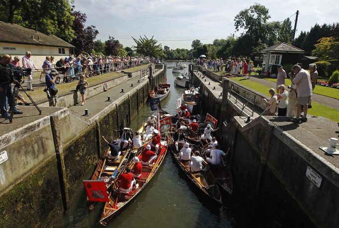 The Queen's Swan Uppers prepare to leave Shepperton Lock for the annual Swan Upping ceremony on the River Thames between Shepperton and Windsor in southern England Engla