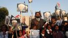 Pakistani Christians hold placards bearing the image of former South African President Nelson Mandela as they gather to pay tribute to Mandela in Islamabad December 10, 2013.