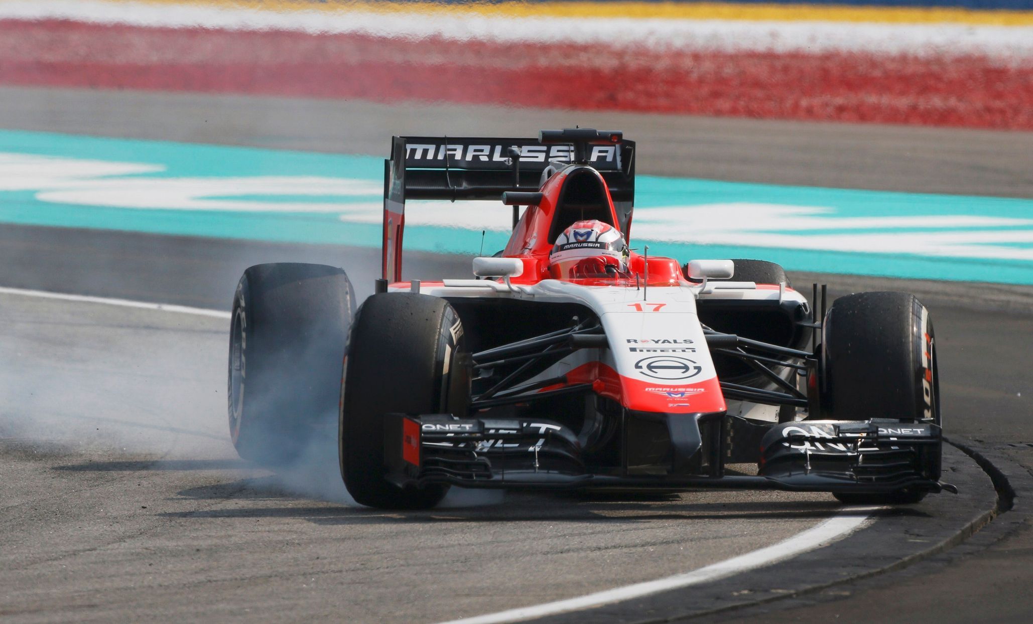 Marussia Formula One driver Bianchi brakes as he takes a corner during the Malaysian F1 Grand Prix at Sepang International Circuit outside Kuala Lumpur