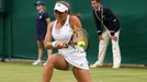 Monica Puig of Puerto Rico hits a return to Sara Errani of Italy in their women's singles tennis match at the Wimbledon Tennis Championships, in London June 24, 2013. REU