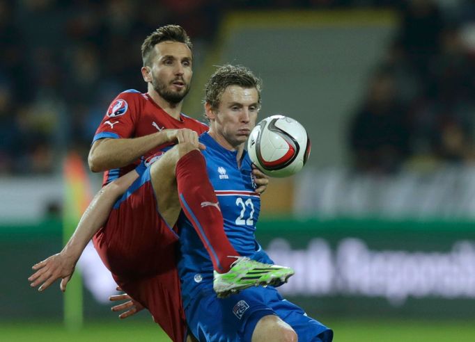 Czech Republic's Tomas Sivok challenges Iceland's Jon Dadi Bodvarsson (R) during their Euro 2016 Group A qualifying soccer match at the Doosan Arena in Plzen November 16,