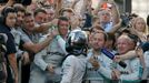 Second placed Mercedes Formula One driver Nico Rosberg of Germany shakes hand with his team members after the first Russian Grand Prix in Sochi October 12, 2014. REUTERS/