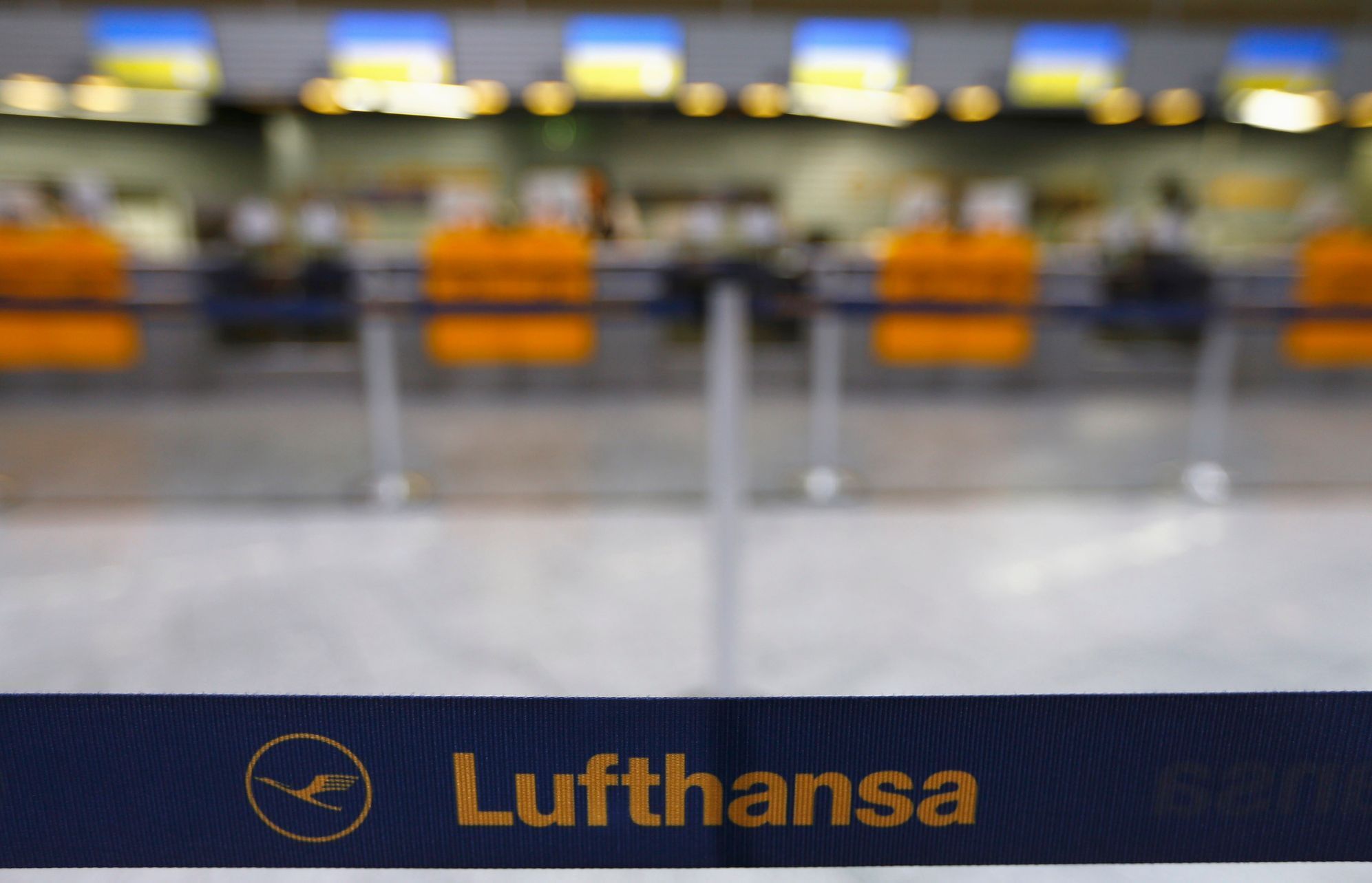 Empty check-in counters of German air carrier Lufthansa are seen at Fraport airport in Frankfurt