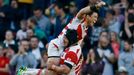 Japan's Harumichi Tatekawas (top) celebrates Karne Hesketh's winning try Reuters / Stefan Wermuth Livepic