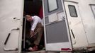 Josh Dummitt of Meriden, Connecticut, prepares for the Cole Brothers Circus of the Stars show as Meatball the clown from his sleeping quarters during a stop in Myrtle Beach, South Carolina, March 31, 2013. Traveling circuses such as the Cole Brothers Circus of the Stars, complete with its big top tent, set up their tent city in smaller markets all along the East Coast of the United States as they aim to bring the circus to rural areas. The Cole Brothers Circus, now in its 129th edition, travels to 100 cities in 20-25 states and stages 250 shows a year. Picture taken March 31, 2013. REUTERS/Randall Hill (UNITED STATES - Tags: SOCIETY ENTERTAINMENT) Published: Dub. 1, 2013, 7 odp.