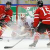 Canada's McDavid makes a pass to Canada's Pouliot in front of Czech Republic's goalie Langhammer during the first period of their IIHF World Junior Championship ice hockey game in Malmo