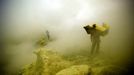 Sulfur Miners Of Ijen Crater Indonesia BANYUWANGI, INDONESIA - UNDATED: Miners lift sulfur at a mine in the crater of Ijen, Banyuwangi, Indonesia. Sulphur miners at the I