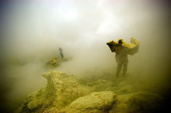 Sulfur Miners Of Ijen Crater Indonesia BANYUWANGI, INDONESIA - UNDATED: Miners lift sulfur at a mine in the crater of Ijen, Banyuwangi, Indonesia. Sulphur miners at the I