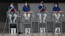 Diving - FINA Diving World Cup 2021 and Tokyo 2020 Olympics Aquatics Test Event - Tokyo Aquatics Centre, Tokyo, Japan - May 6, 2021 Judges wearing protective face masks d