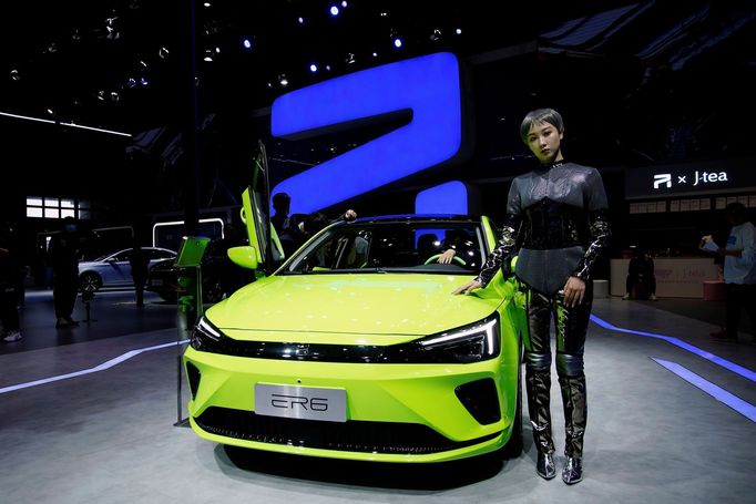 A model stands next to a Roewe ER6 electric vehicle (EV) of SAIC Motor during a media day for the Auto Shanghai show in Shanghai, China April 19, 2021. REUTERS/Aly Song